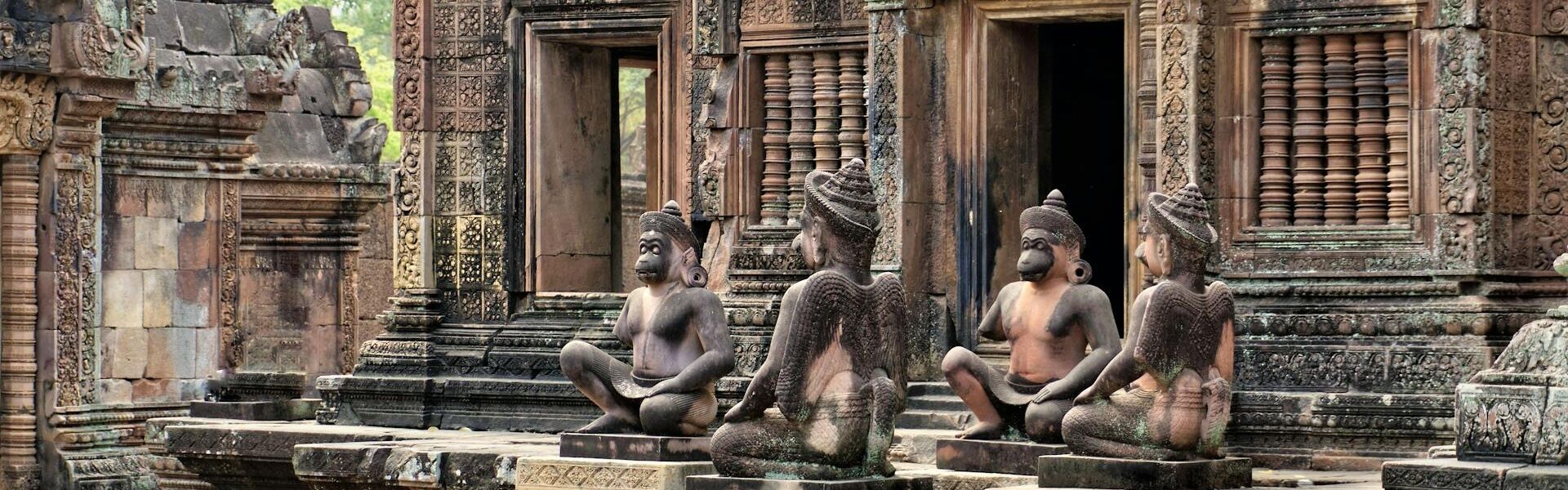 Intricate carvings at Banteay Srei temple during a Cambodia Banteay Srei Tours experience with Legend Travel Group.